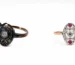 Two vintage rings on a white backdrop: a dark oxidized ring with a central diamond on the left, and a rose gold band with a silver setting and pink gems on the right.