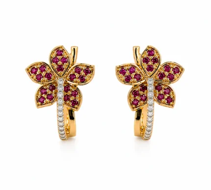Pair of gold flower-shaped earrings with purple gemstones and a diamond-studded stem.
