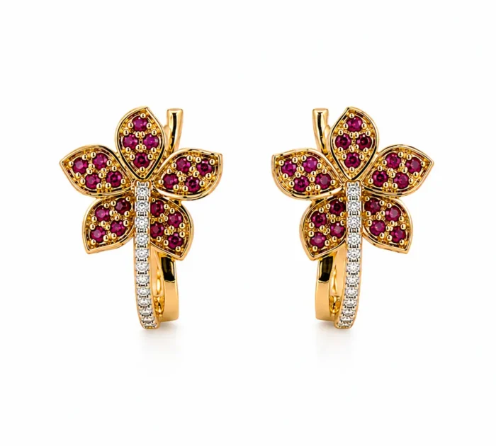 Pair of gold flower-shaped earrings with purple gemstones and a diamond-studded stem.