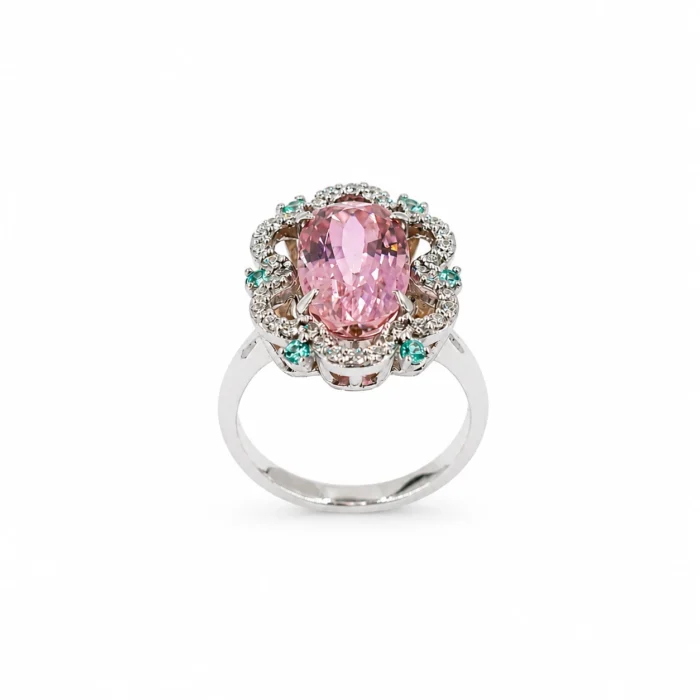 Elegant silver ring with a large pink oval gemstone surrounded by pavé diamonds and small turquoise accents, on a white background.